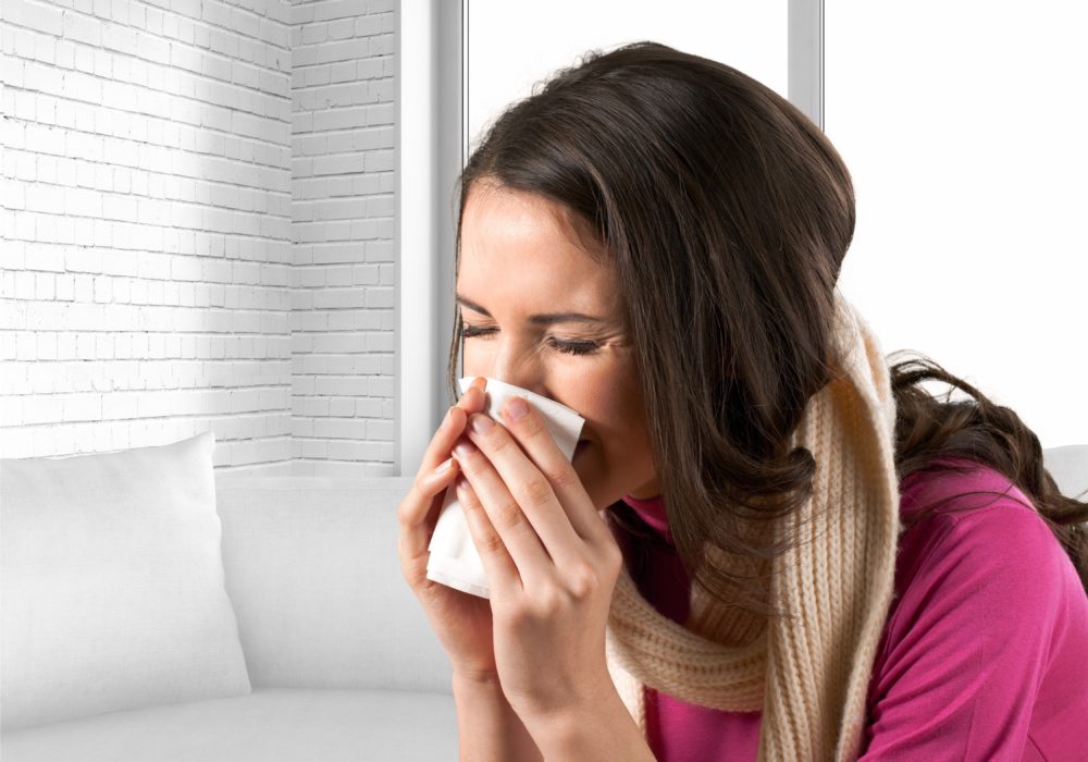 Woman Sneezing